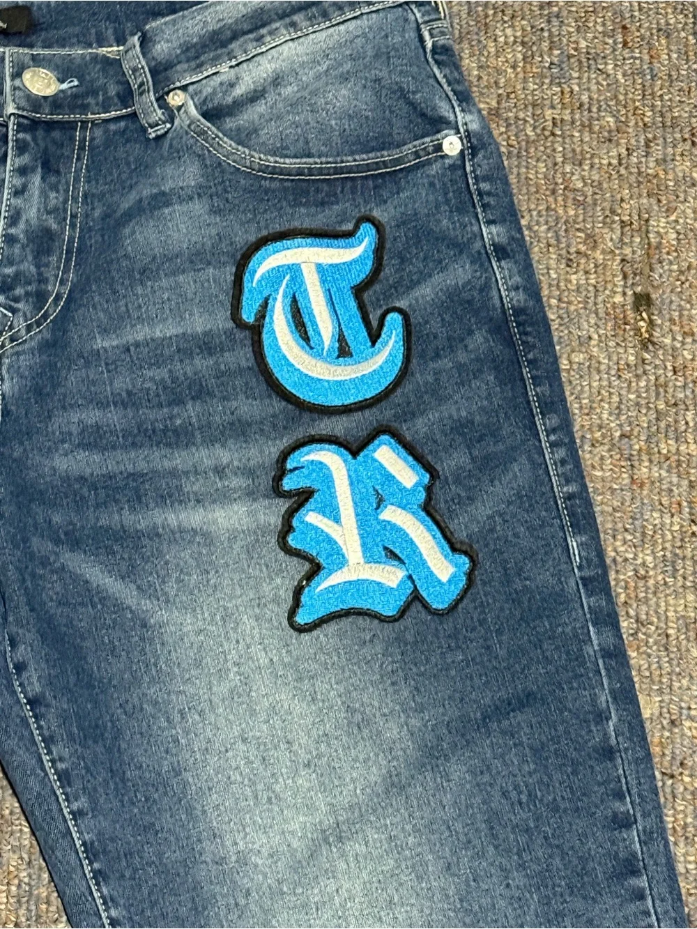 True Religion Men's Blue Jeans with Turquoise Script Patch